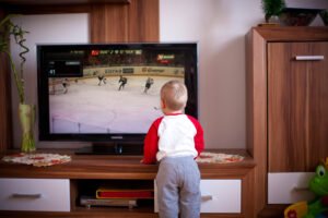 kid watching tv closely is sign of vision problem